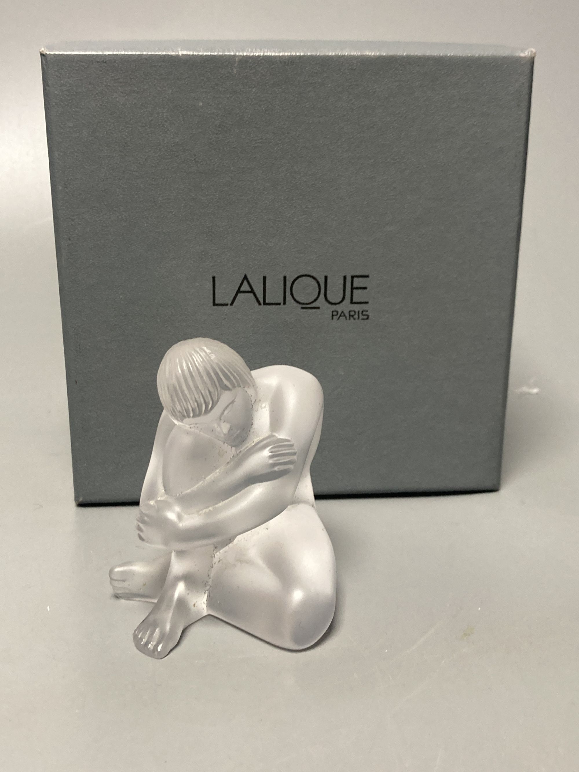 A Lalique seated figural paperweight, height 7cm, boxed